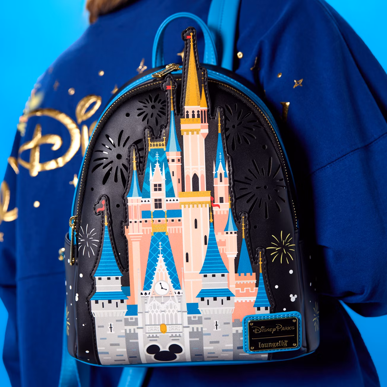 cinderella castle mini backpack by loungefly Exclusive Holiday Light Up | Officially Licensed | Plastic/Vegan Leather up multicolor pyrotechnics show when you flip the switch inside the front pocket. Light-Up Cinderella Castle Loungefly Mini