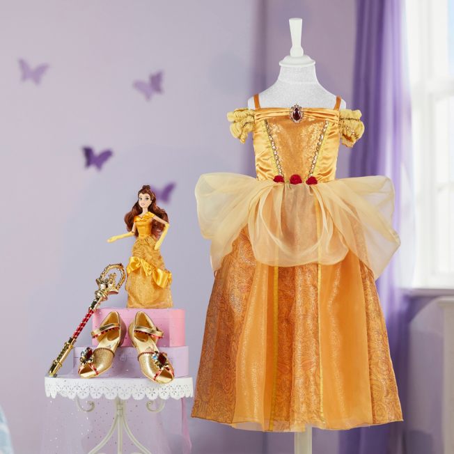 princess belle dresses Belle's Dream Big Matching Ensemble that she would eventually grace the ballroom in a beautiful golden gown Disney 15 Tall Porcelain-Blend Poseable
